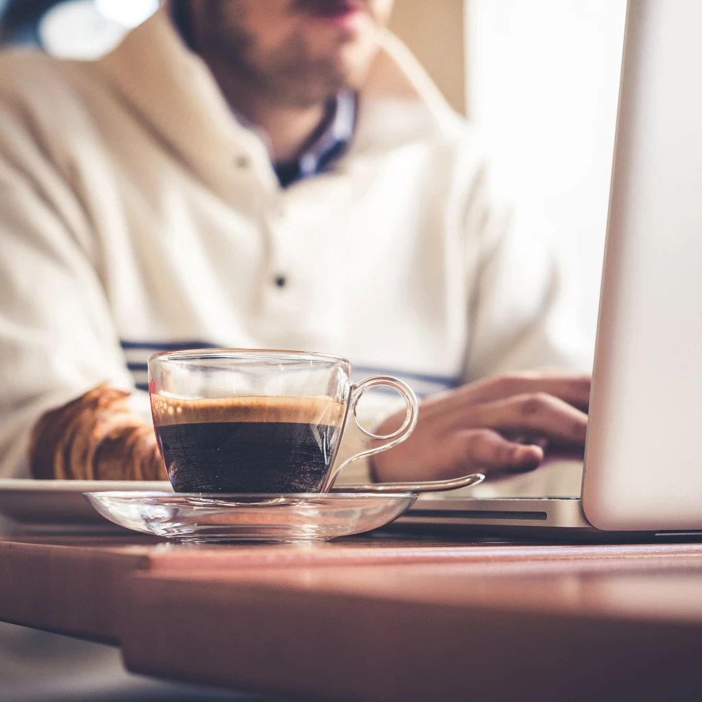 ___coffee cup and man in the background.2385655233284291637.jpg