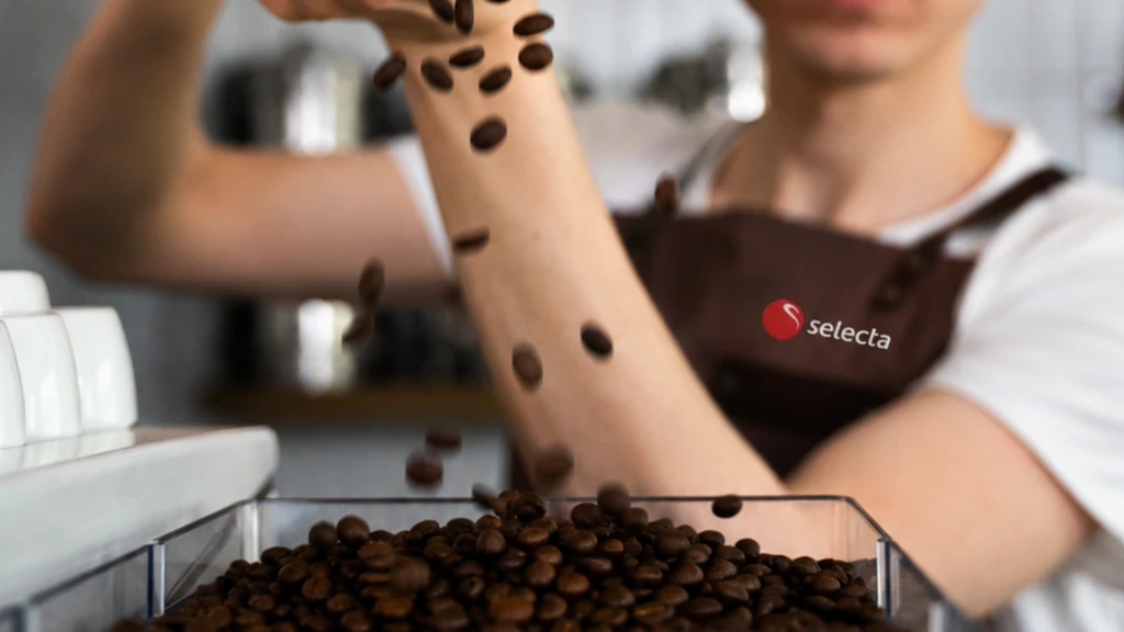Påfylling av kaffebønner i kaffemaskin